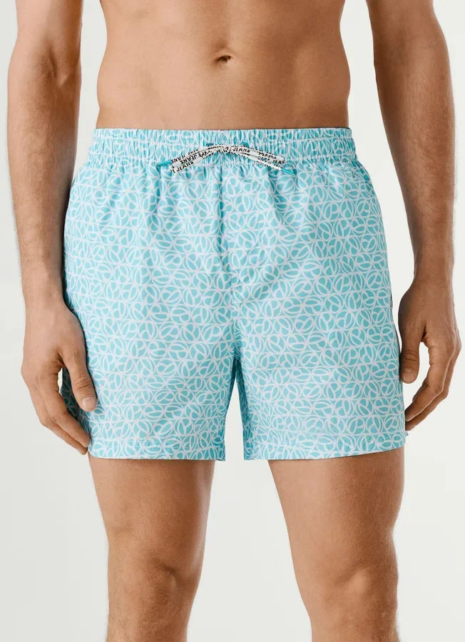 Badeshorts mit durchgehendem Monogramm Badeshorts mit durchgehendem Monogramm