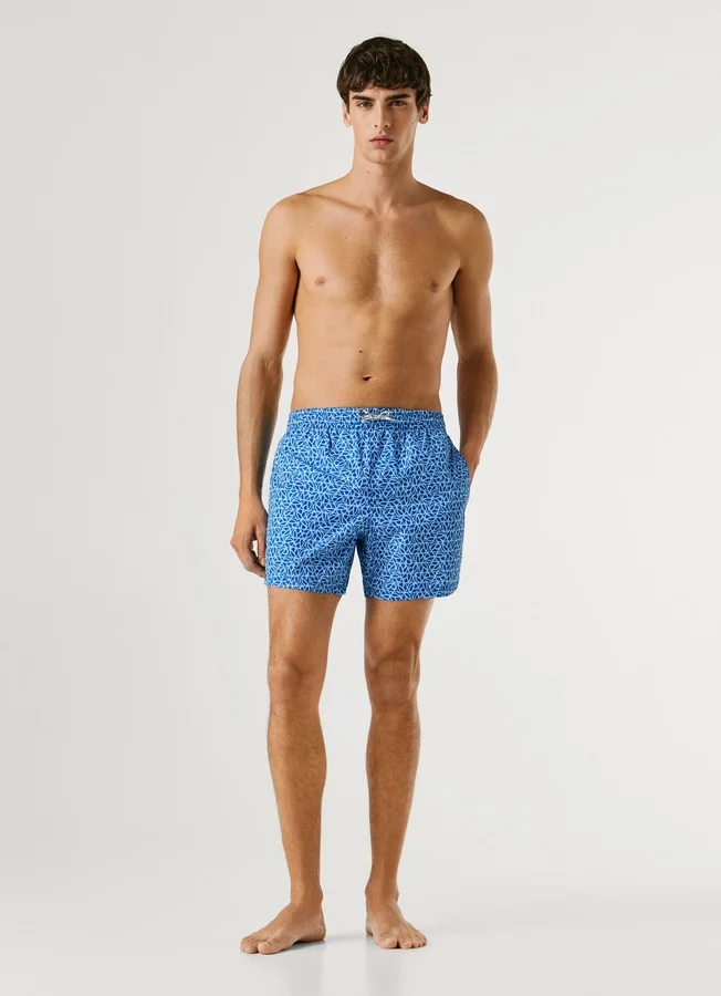 Badeshorts mit durchgehendem Monogramm Badeshorts mit durchgehendem Monogramm