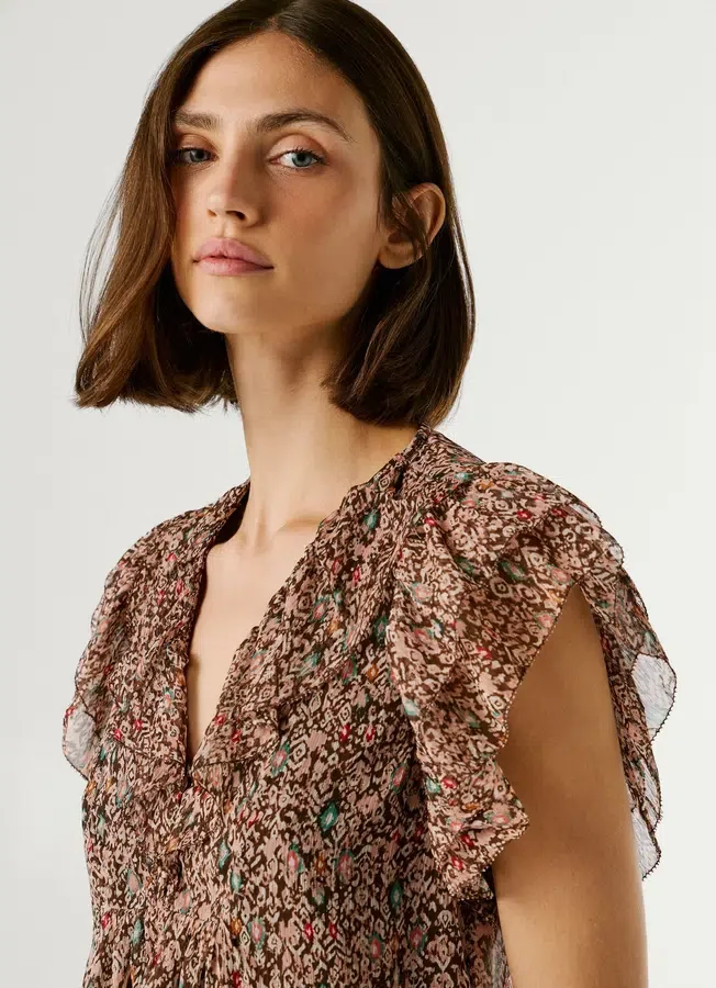 Bluse mit V-Ausschnitt und Rüschen Bluse mit V-Ausschnitt und Rüschen