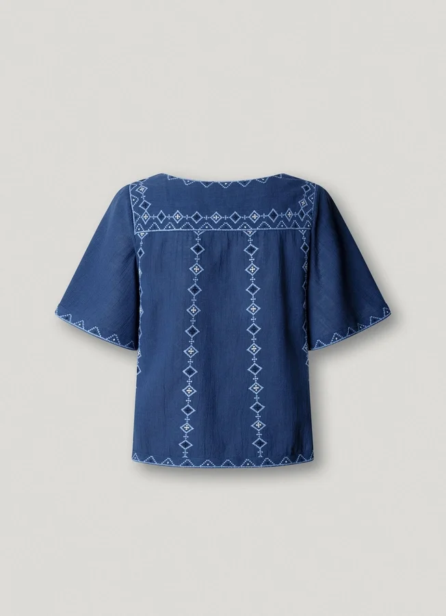 Bluse mit V-Ausschnitt und Stickdetails Bluse mit V-Ausschnitt und Stickdetails