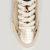 Goldene Sneaker mit Animal-Print-Details