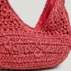 Halbmondförmige Raffia-Handtasche