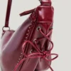 Handtasche in Halbmondform in Lederoptik