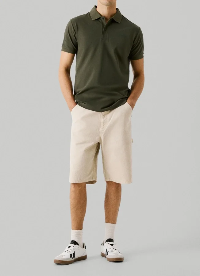 Piqué-Polo mit Aufdruck auf der Rückseite Piqué-Polo mit Aufdruck auf der Rückseite