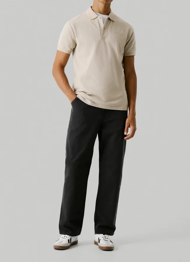 Piqué-Polo mit Aufdruck auf der Rückseite Piqué-Polo mit Aufdruck auf der Rückseite