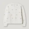 Pointelle-Strickjacke mit gestickten Blumen Pointelle-Strickjacke mit gestickten Blumen