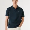 Stückgefärbtes Piqué-Poloshirt Stückgefärbtes Piqué-Poloshirt