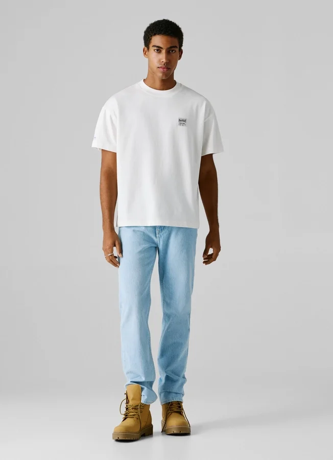 T-Shirt mit Rückenaufdruck und lockerer Passform T-Shirt mit Rückenaufdruck und lockerer Passform