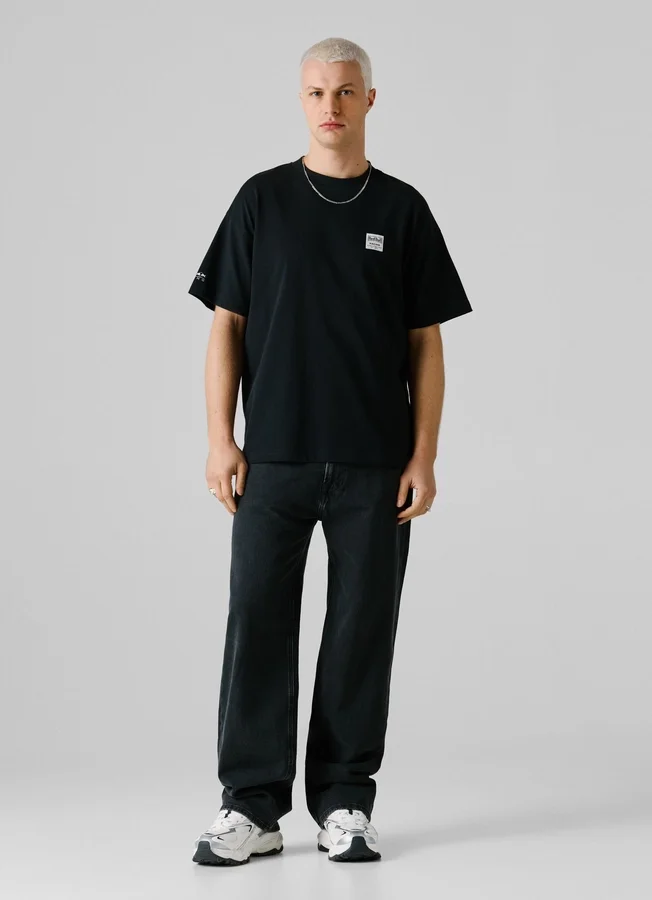 T-Shirt mit Rückenaufdruck und lockerer Passform T-Shirt mit Rückenaufdruck und lockerer Passform